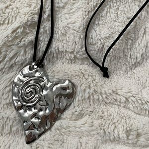 Pounded silver heart necklace with adjustable black cord
